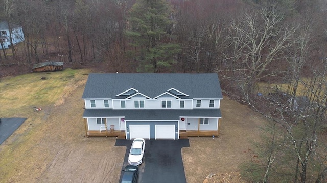 view of front of home with a porch and a garage