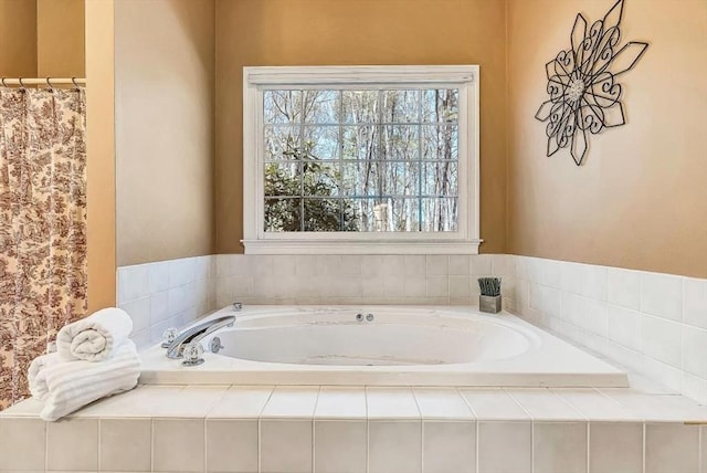 bathroom with a bath and curtained shower