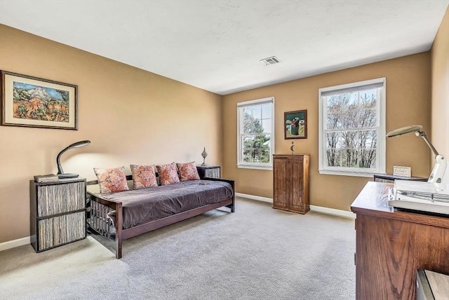 bedroom with carpet floors and baseboards
