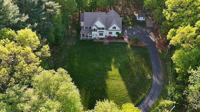 view from above of property with a heavily wooded area