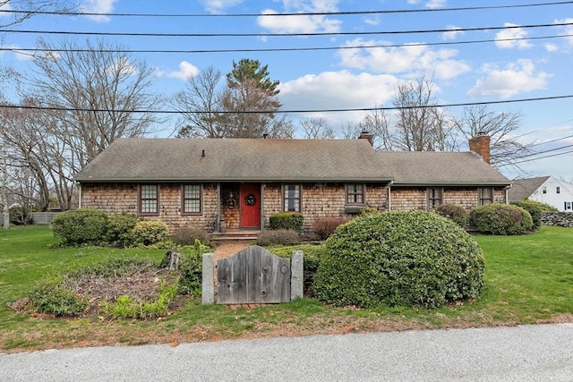 1 Pine Ln, Warren, RI 02885 - view of front facade with roof with shingles, a chimney, and a front lawn