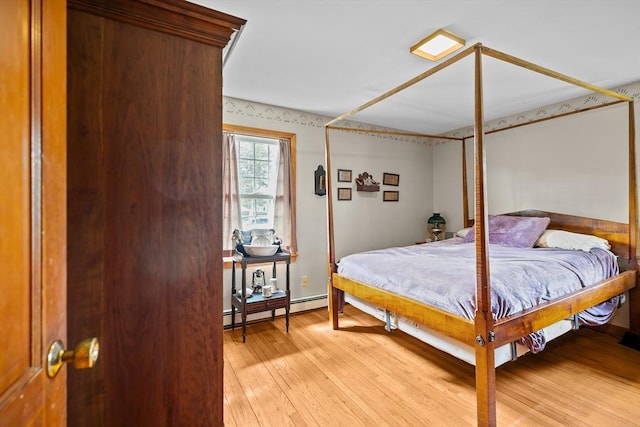 1 Pine Ln, Warren, RI 02885 - bedroom with a baseboard heating unit and light wood finished floors