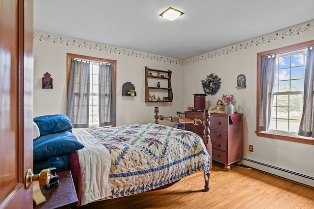 1 Pine Ln, Warren, RI 02885 - bedroom featuring a baseboard radiator and light wood-style flooring
