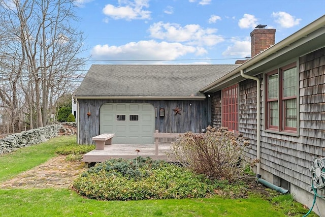 1 Pine Ln, Warren, RI 02885 - rear view of property with a garage and a chimney