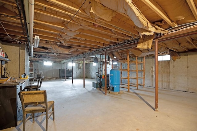 1 Pine Ln, Warren, RI 02885 - below grade area with a water pressure tank and a heating unit