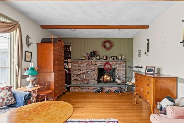 1 Pine Ln, Warren, RI 02885 - living room featuring beam ceiling, wood finished floors, and a fireplace