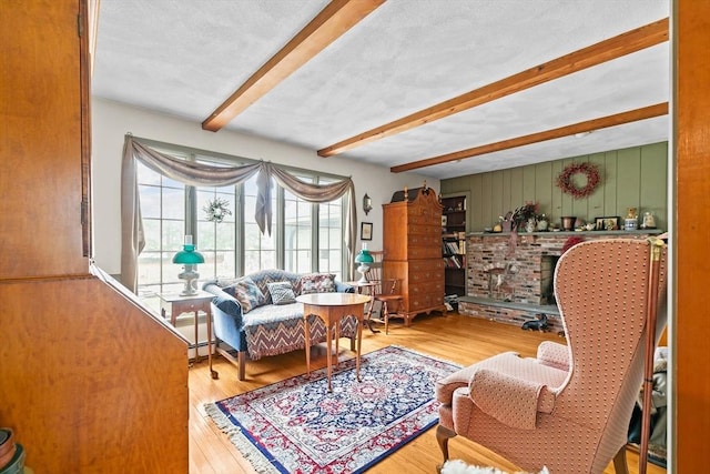 1 Pine Ln, Warren, RI 02885 - living room with beamed ceiling and wood finished floors