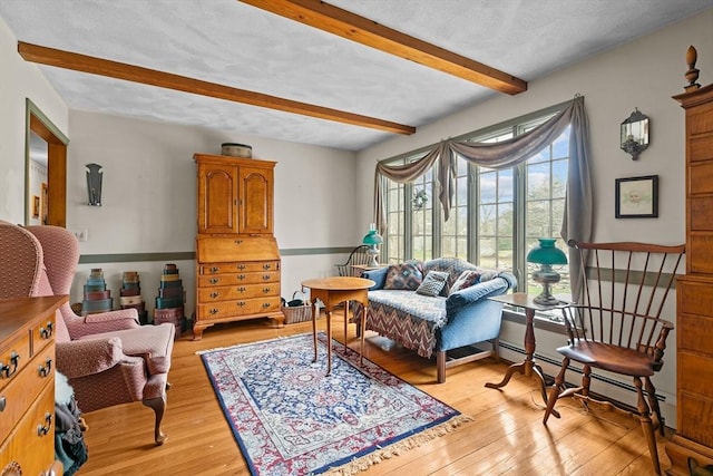 1 Pine Ln, Warren, RI 02885 - sitting room with beamed ceiling, light wood-type flooring, and baseboard heating