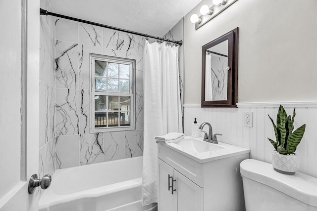 full bathroom with toilet, a textured ceiling, shower / tub combo with curtain, and vanity