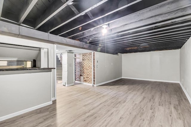 basement featuring hardwood / wood-style floors