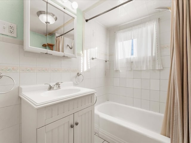 bathroom featuring vanity, decorative backsplash, tile walls, and shower / tub combo