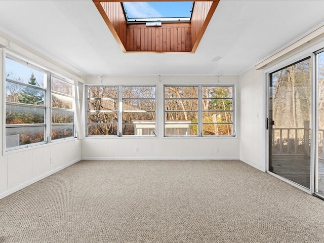 unfurnished sunroom featuring a skylight and a healthy amount of sunlight