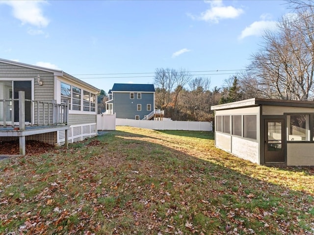 view of yard featuring a sunroom