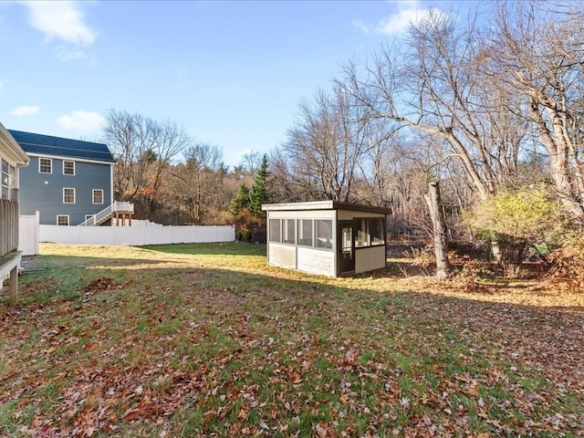 view of yard featuring a sunroom