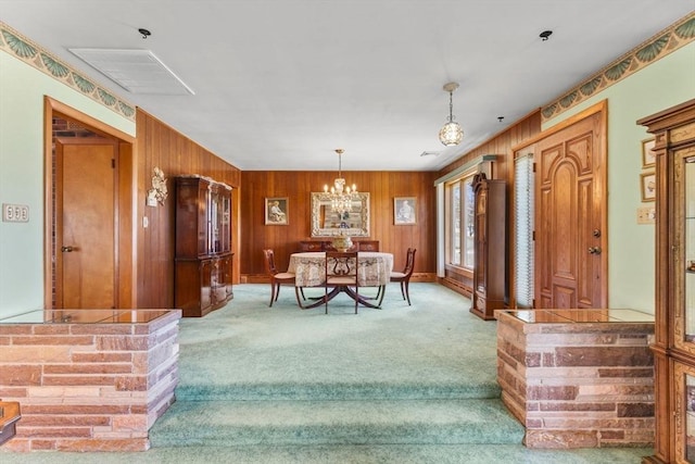 interior space with wood walls and an inviting chandelier