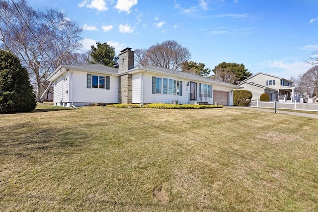 single story home with a garage, a chimney, and a front yard