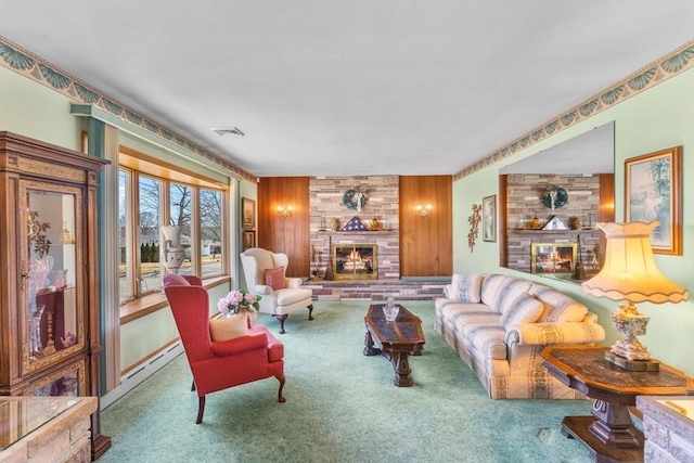 carpeted living room featuring visible vents, wooden walls, and a fireplace