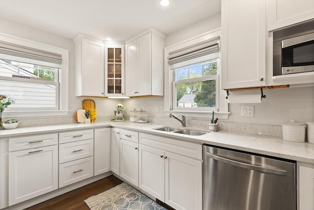61 Howitt Rd, Boston, MA 02132 - kitchen featuring appliances with stainless steel finishes, a sink, white cabinetry, recessed lighting, and glass insert cabinets