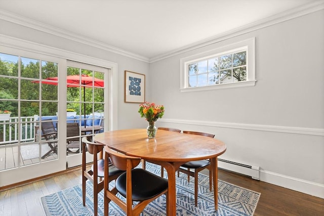 61 Howitt Rd, Boston, MA 02132 - dining space featuring a baseboard heating unit, wood finished floors, crown molding, and baseboards