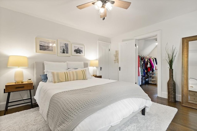 61 Howitt Rd, Boston, MA 02132 - bedroom featuring a spacious closet, baseboards, a closet, and dark wood finished floors