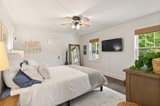 61 Howitt Rd, Boston, MA 02132 - bedroom featuring multiple windows, dark wood-style floors, baseboards, and ceiling fan