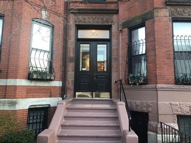 342 Commonwealth Ave Unit 2, Boston, MA 02115 - view of exterior entry featuring french doors and brick siding