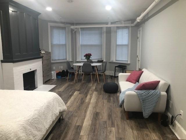 342 Commonwealth Ave Unit 2, Boston, MA 02115 - bedroom with wood finished floors, a high end fireplace, recessed lighting, and baseboards