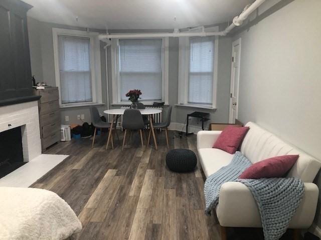 342 Commonwealth Ave Unit 2, Boston, MA 02115 - living room with wood finished floors and a fireplace