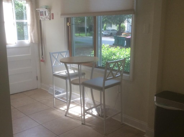 22 Smith St, Norton, MA 02766 - dining room with light tile patterned floors and baseboards