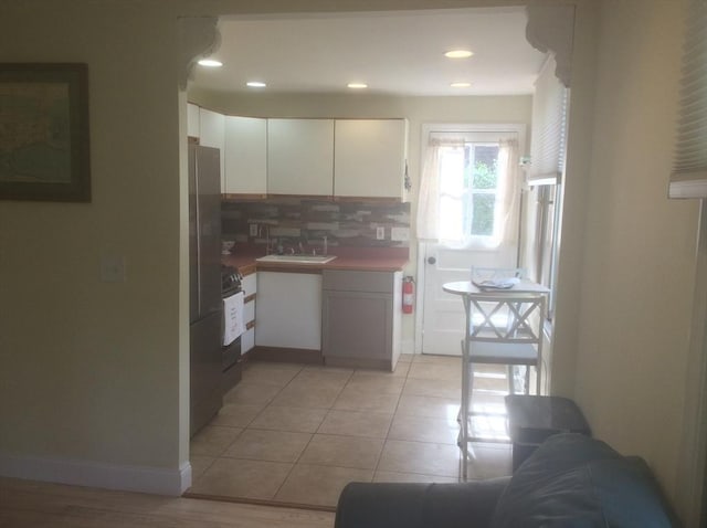 22 Smith St, Norton, MA 02766 - kitchen featuring white cabinetry, backsplash, range, recessed lighting, and baseboards