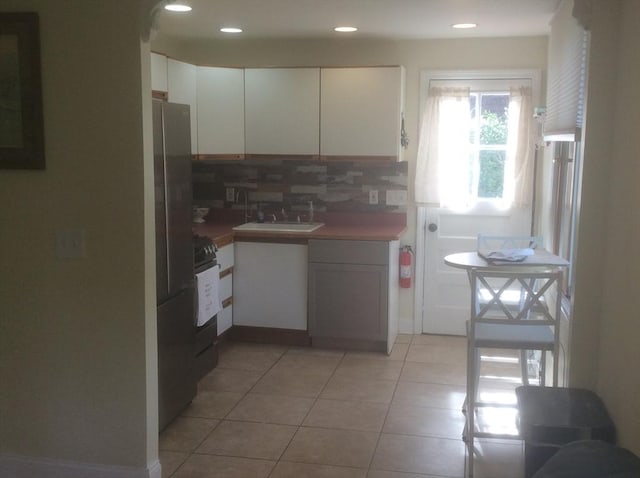 22 Smith St, Norton, MA 02766 - kitchen featuring range, white cabinetry, tasteful backsplash, and recessed lighting