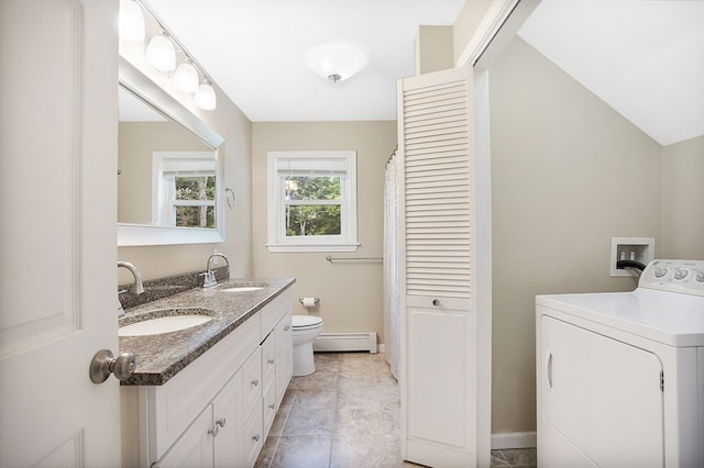 laundry area featuring washer / clothes dryer, a baseboard heating unit, sink, and light tile patterned floors