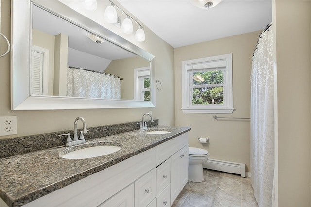 bathroom with a baseboard radiator, tile patterned flooring, toilet, and vanity