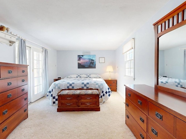 bedroom featuring light carpet