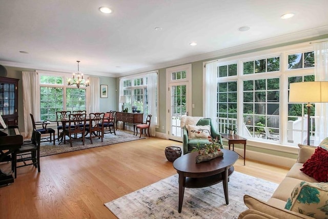 32 Twitchell St, Wellesley, MA 02482 - living area with ornamental molding, a chandelier, light wood-type flooring, plenty of natural light, and recessed lighting