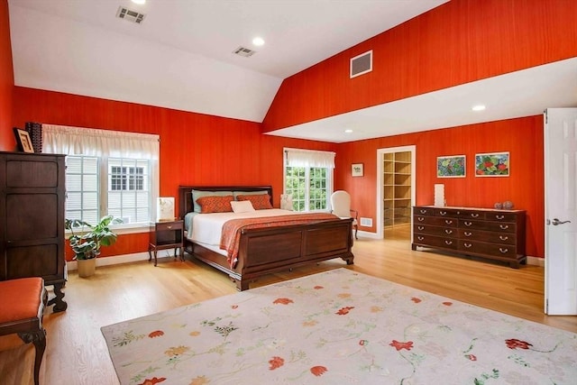 32 Twitchell St, Wellesley, MA 02482 - bedroom featuring wood finished floors, wood walls, vaulted ceiling, and baseboards