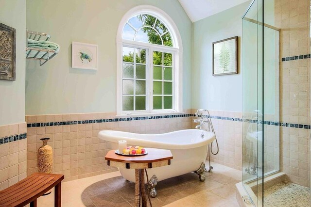 32 Twitchell St, Wellesley, MA 02482 - bathroom featuring tile walls, a stall shower, wainscoting, a freestanding tub, and tile patterned floors