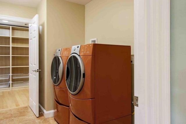 32 Twitchell St, Wellesley, MA 02482 - washroom featuring separate washer and dryer and baseboards