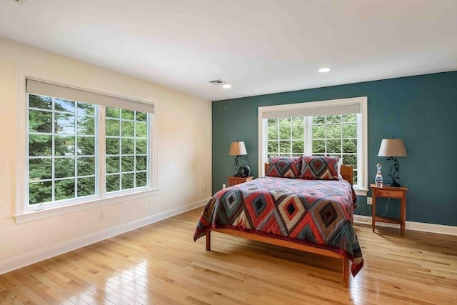 32 Twitchell St, Wellesley, MA 02482 - bedroom featuring baseboards, multiple windows, light wood-style floors, and recessed lighting