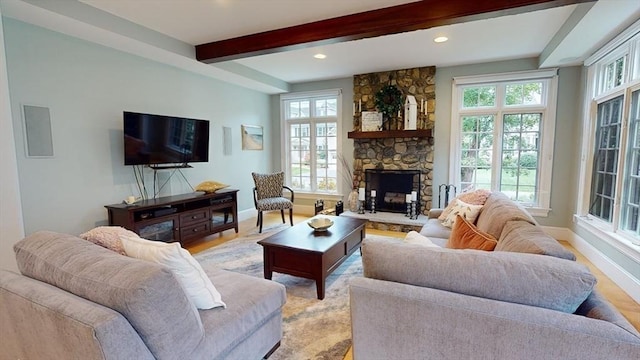 32 Twitchell St, Wellesley, MA 02482 - living area with baseboards, a fireplace, beam ceiling, recessed lighting, and light wood-style flooring