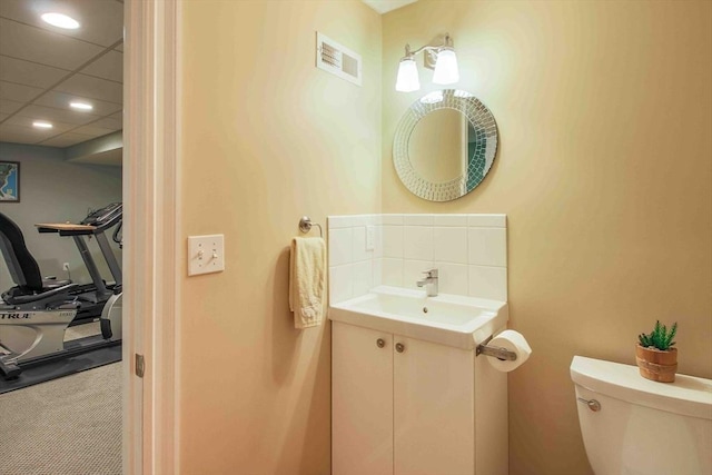 32 Twitchell St, Wellesley, MA 02482 - half bath with toilet, vanity, and tasteful backsplash