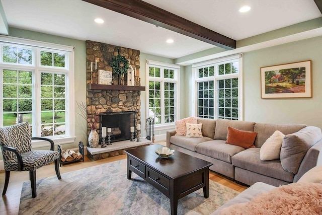 32 Twitchell St, Wellesley, MA 02482 - living area with light wood-type flooring, recessed lighting, plenty of natural light, beam ceiling, and a stone fireplace