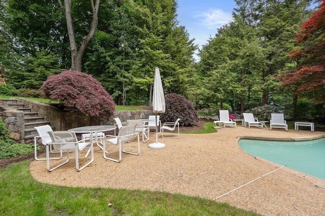 12 Laurus Ln, Newton, MA 02459 - swimming pool featuring a patio