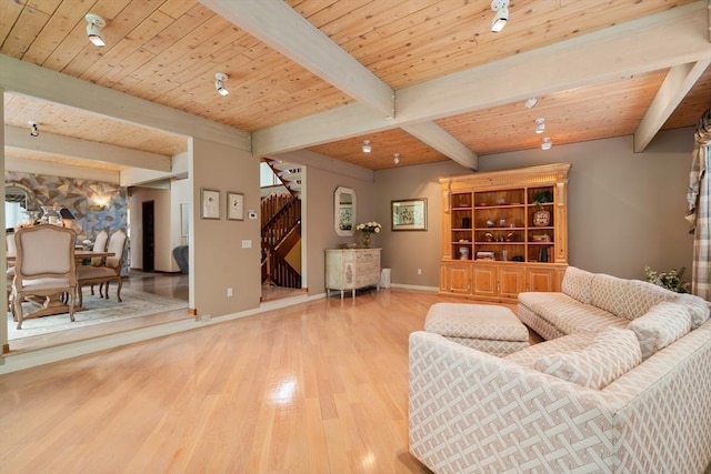12 Laurus Ln, Newton, MA 02459 - living area with stairway, wood finished floors, and a wooden ceiling with exposed beams