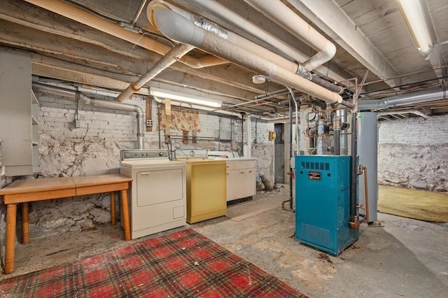 basement featuring gas water heater and independent washer and dryer