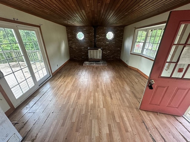 38 Conlyn Ave, Franklin, MA 02038 - unfurnished living room with a wood stove, hardwood / wood-style floors, and wood ceiling