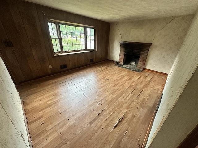 38 Conlyn Ave, Franklin, MA 02038 - unfurnished living room with wood-type flooring and a brick fireplace