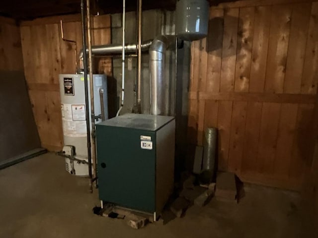 utility room with gas water heater