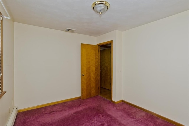 empty room featuring a baseboard radiator and carpet flooring