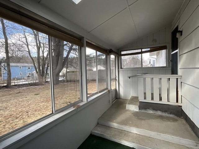 unfurnished sunroom with vaulted ceiling